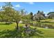 Outdoor seating area near the pond, perfect for enjoying the beautiful community at 7000 E Quincy Ave # 302, Denver, CO 80237