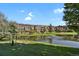 Beautiful condo community overlooking the pond and water fountain on a sunny day at 7000 E Quincy Ave # 302, Denver, CO 80237