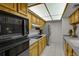 Efficient kitchen with stainless steel appliances, including oven, and ample storage at 7000 E Quincy Ave # 302, Denver, CO 80237