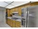 Well-equipped kitchen with stainless steel appliances, modern cooktop, and ample counter space at 7000 E Quincy Ave # 302, Denver, CO 80237