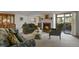 This well-appointed living room is anchored by a cozy fireplace and offers access to an outdoor patio at 7000 E Quincy Ave # 302, Denver, CO 80237