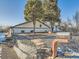 Charming home featuring mature trees, stone accents, brick mailbox and nice front yard at 5665 Niagara St, Commerce City, CO 80022