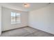 Cozy bedroom with soft carpet and a bright window, perfect for relaxation at 747 Raindance St, Erie, CO 80516