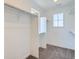 Walk-in closet featuring built-in shelving and ample storage space at 747 Raindance St, Erie, CO 80516