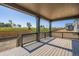Large outdoor deck with wood railings and open views of the surrounding landscape at 747 Raindance St, Erie, CO 80516