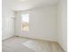 Bright bedroom features a large window and closet with sliding doors at 9332 Bahama Ct, Commerce City, CO 80022