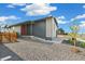 Home exterior with gravel landscaping and vibrant tree at 9332 Bahama Ct, Commerce City, CO 80022
