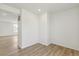 Bright room with light wood floors, white walls, and natural light, ideal for office or den at 9332 Bahama Ct, Commerce City, CO 80022