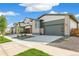 Street view of houses with modern exteriors and landscaping at 9332 Bahama Ct, Commerce City, CO 80022
