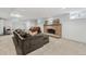 Finished basement featuring neutral carpet, brick fireplace and comfortable seating at 629 Bellaire St, Denver, CO 80220
