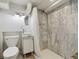 Bathroom features a modern vanity and marble tiled shower at 629 Bellaire St, Denver, CO 80220