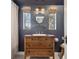 Charming bathroom featuring a wood vanity, modern lighting, and stylish fixtures at 629 Bellaire St, Denver, CO 80220