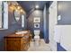 Modern bathroom featuring a sink, toilet, and wooden vanity with neutral colors at 629 Bellaire St, Denver, CO 80220