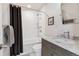 Stylish bathroom with a shower-tub combination, marble countertops, and modern fixtures at 629 Bellaire St, Denver, CO 80220