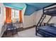 Bedroom features a built-in bunk bed, study desk and a colorful ceiling at 629 Bellaire St, Denver, CO 80220