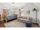 Bedroom featuring natural light, a comfortable couch, and modern fixtures at 629 Bellaire St, Denver, CO 80220