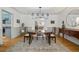 Bright dining room featuring a round table with four chairs, wainscoting and stylish decor at 629 Bellaire St, Denver, CO 80220