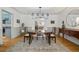 Formal dining room showcasing hardwood floors, neutral walls, and an elegant chandelier at 629 Bellaire St, Denver, CO 80220