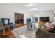 Cozy living room featuring stylish furniture, skylights, and an adjacent dining area at 629 Bellaire St, Denver, CO 80220