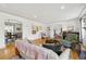 Stylishly furnished living room boasting hardwood floors, plenty of seating, and open access to other living spaces at 629 Bellaire St, Denver, CO 80220
