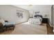 This is a beautifully staged main bedroom with great natural light and ample floor space at 629 Bellaire St, Denver, CO 80220