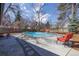 Backyard pool area features outdoor seating at 629 Bellaire St, Denver, CO 80220