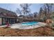 Backyard pool is adjacent to the home and patio seating at 629 Bellaire St, Denver, CO 80220