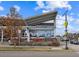 Modern restaurant exterior with patio seating, large windows, and eye catching sign at 629 Bellaire St, Denver, CO 80220