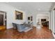 Comfortable sitting area featuring tile floors, stylish furniture, and seamless flow to other rooms at 629 Bellaire St, Denver, CO 80220