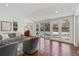 Bright sunroom with a view of the pool, features large windows, and comfortable seating arrangements at 629 Bellaire St, Denver, CO 80220