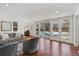 Bright sun room with large windows and access to the outdoor pool area at 629 Bellaire St, Denver, CO 80220