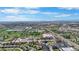 Expansive aerial view showcasing the neighborhood, nearby lakes, and cityscape in the distance at 875 E 78Th Ave # 21, Denver, CO 80229