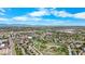 Impressive aerial view highlights the neighborhood's serene setting with mountain views, open green spaces and walking trails at 875 E 78Th Ave # 21, Denver, CO 80229