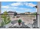 Inviting balcony area with a view of the parking lot and surrounding landscape at 875 E 78Th Ave # 21, Denver, CO 80229