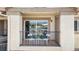 Private balcony with sliding glass door and views; furnished with table, two chairs and a potted plant at 875 E 78Th Ave # 21, Denver, CO 80229