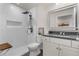 Modern bathroom featuring a rainfall shower head, decorative wall tiles, and a sleek vanity at 875 E 78Th Ave # 21, Denver, CO 80229