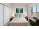 Staged primary bedroom with good light, stylish decor, and double closet at 875 E 78Th Ave # 21, Denver, CO 80229