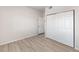 Bedroom with plank floors and large mirrored closet at 875 E 78Th Ave # 21, Denver, CO 80229