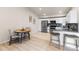 Bright eat-in kitchen features stainless appliances, white cabinets, and modern countertops at 875 E 78Th Ave # 21, Denver, CO 80229