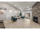 Bright living room with vaulted ceilings, fireplace, and sliding glass doors to outdoor area at 875 E 78Th Ave # 21, Denver, CO 80229