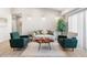 Inviting living room with stylish furniture, modern lighting, and a large window at 875 E 78Th Ave # 21, Denver, CO 80229