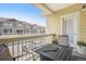 Cozy balcony view with seating area overlooking the street with views of neighboring homes at 9434 Ashbury Cir # 204, Parker, CO 80134