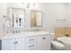Bathroom featuring double vanity sinks with modern fixtures and a soaking tub at 9434 Ashbury Cir # 204, Parker, CO 80134