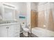 Well-lit bathroom with single vanity, bathtub, and shower with tile surround at 9434 Ashbury Cir # 204, Parker, CO 80134