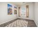 Bedroom featuring a large window and urban decor art prints on the wall at 9434 Ashbury Cir # 204, Parker, CO 80134