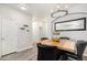 Dining area boasts modern lighting, ample space, and easy access to the kitchen, ideal for entertaining at 9434 Ashbury Cir # 204, Parker, CO 80134