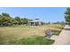 Community gazebo on expansive lawn with bench seating at 9434 Ashbury Cir # 204, Parker, CO 80134