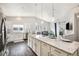 Bright, open kitchen with a large center island, stainless steel appliances, and modern lighting at 9434 Ashbury Cir # 204, Parker, CO 80134