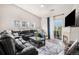 Cozy living room featuring a fireplace, comfortable leather sofa, and natural light with a mountain view at 9434 Ashbury Cir # 204, Parker, CO 80134