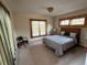 Serene bedroom with a comfortable bed and window seat at 4924 S Indian Trl, Evergreen, CO 80439
